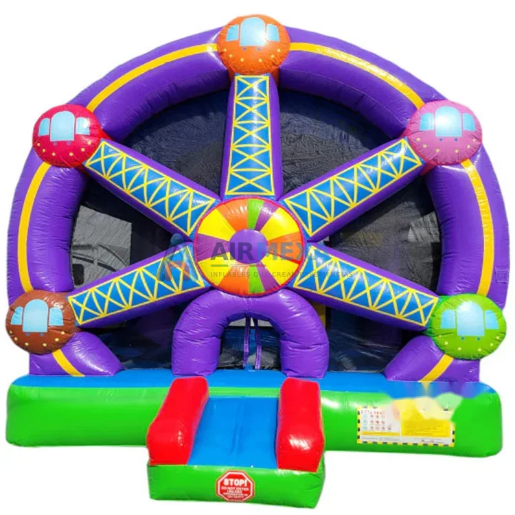 Castillo inflable temático de rueda de la fortuna instalado en evento