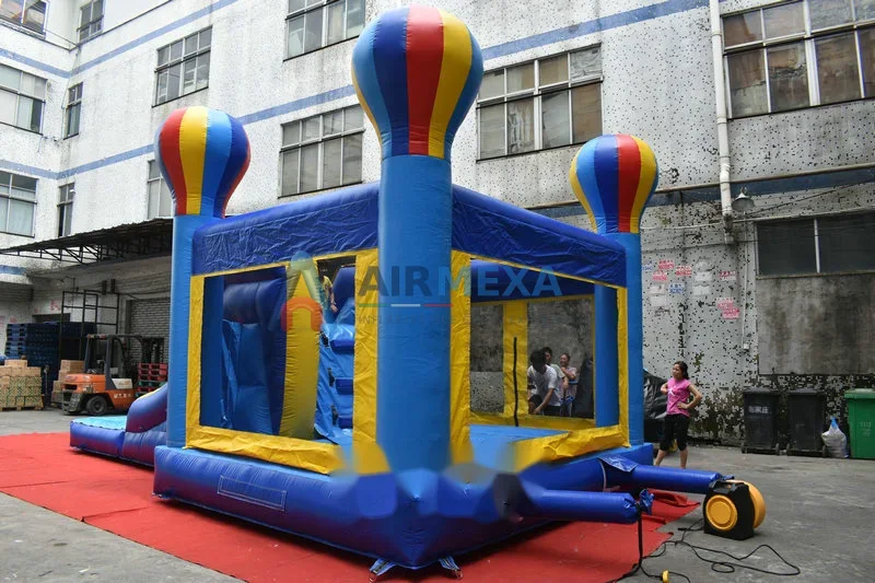 Combo inflable Party Time con resbaladilla y temática festiva instalado en exterior