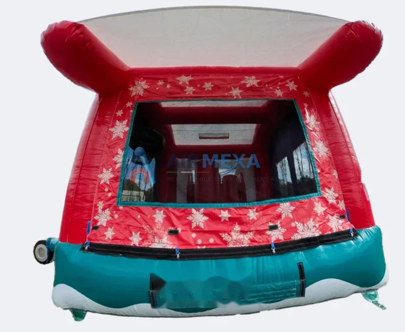 Combo inflable navideño con Santa Claus y doble resbaladilla en evento decembrino