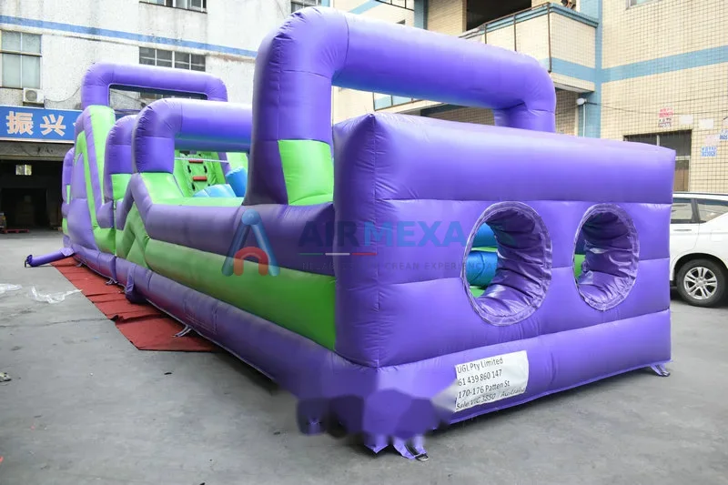Pista de obstáculos inflable morada de 15 metros con túneles y tramos de carrera